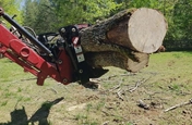 New Grapple lifting a log